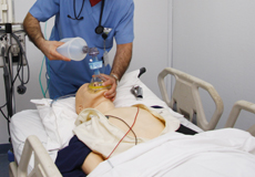 Doctors performing CRP training doll