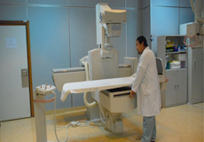 healthcare worker with x-ray machine
