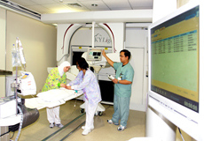 healthcare workers with a radiation machine