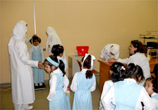 staff nurse doing measurements for female students