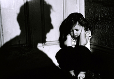 Little Girl Covering Her Ears with a Shadow of an Adult Screaming